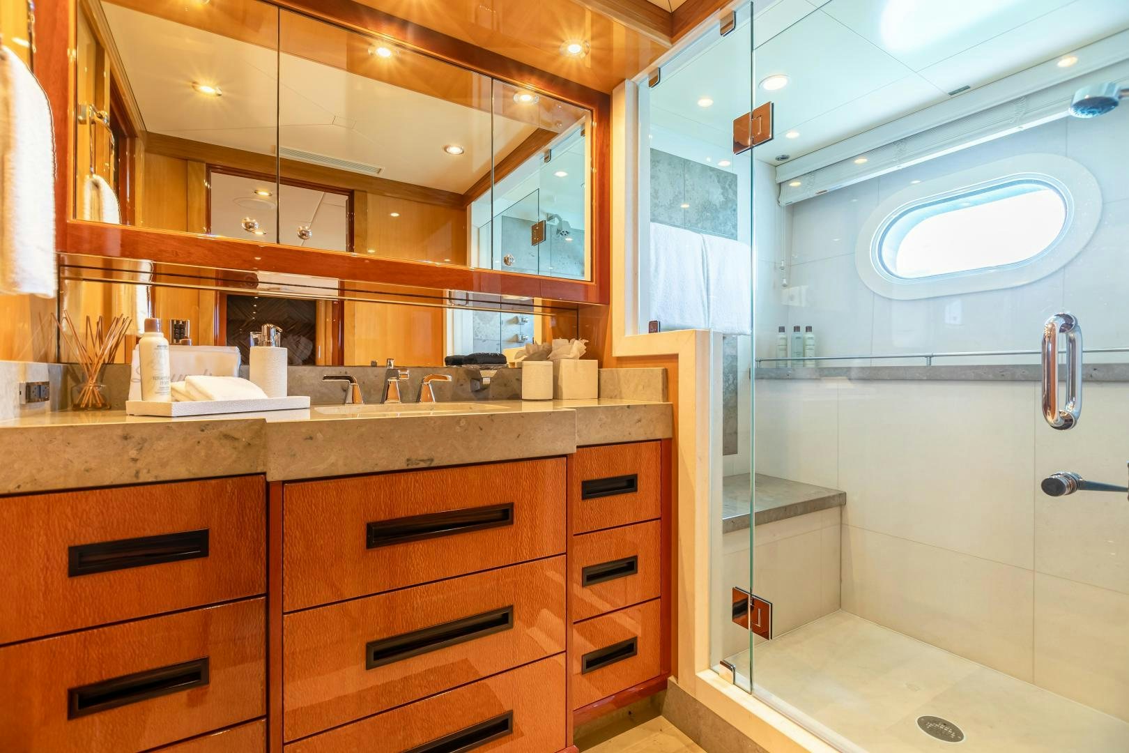 a bathroom with a large mirror aboard IMPROMPTU Yacht for Sale