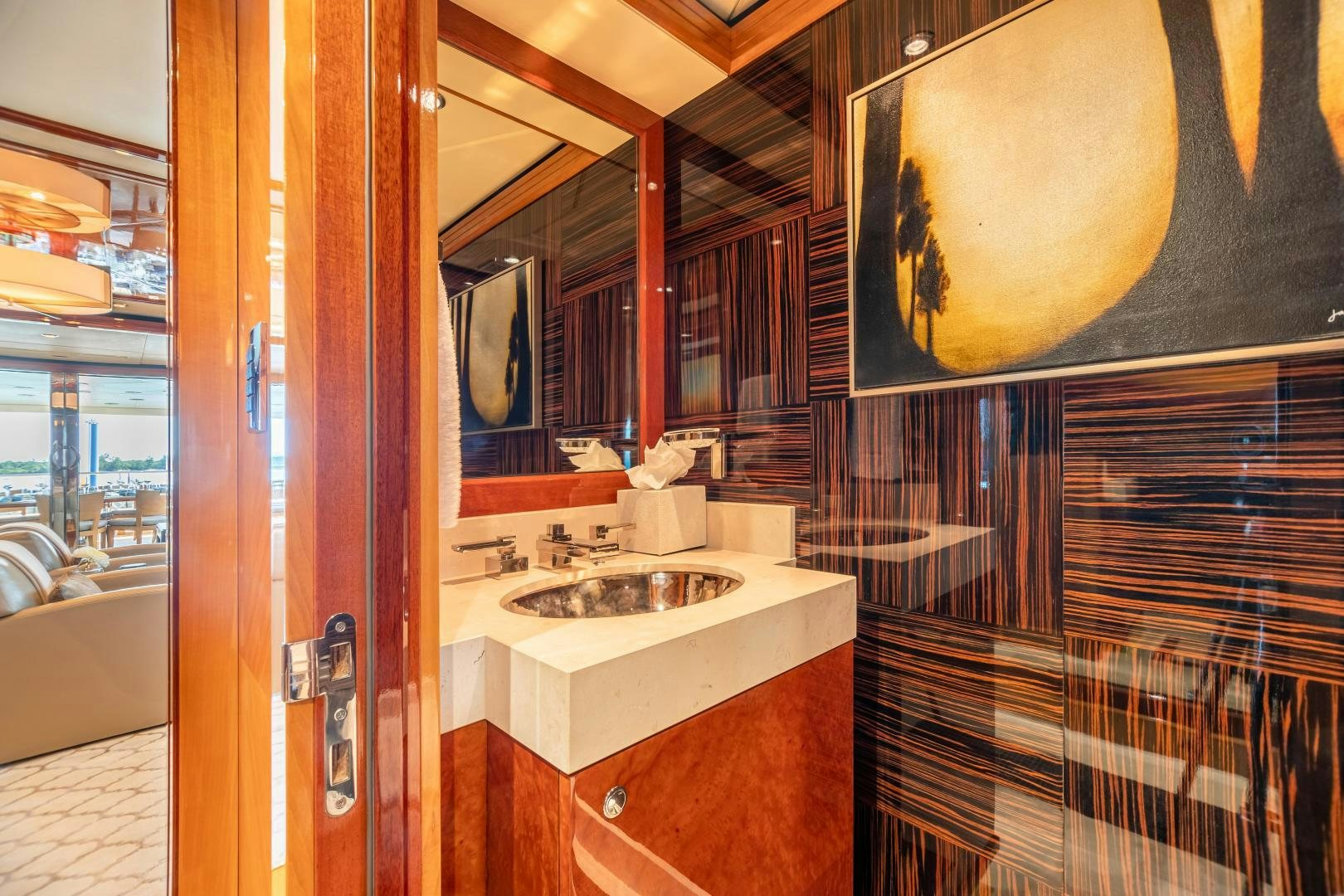 a bathroom with a sink and a mirror aboard IMPROMPTU Yacht for Charter
