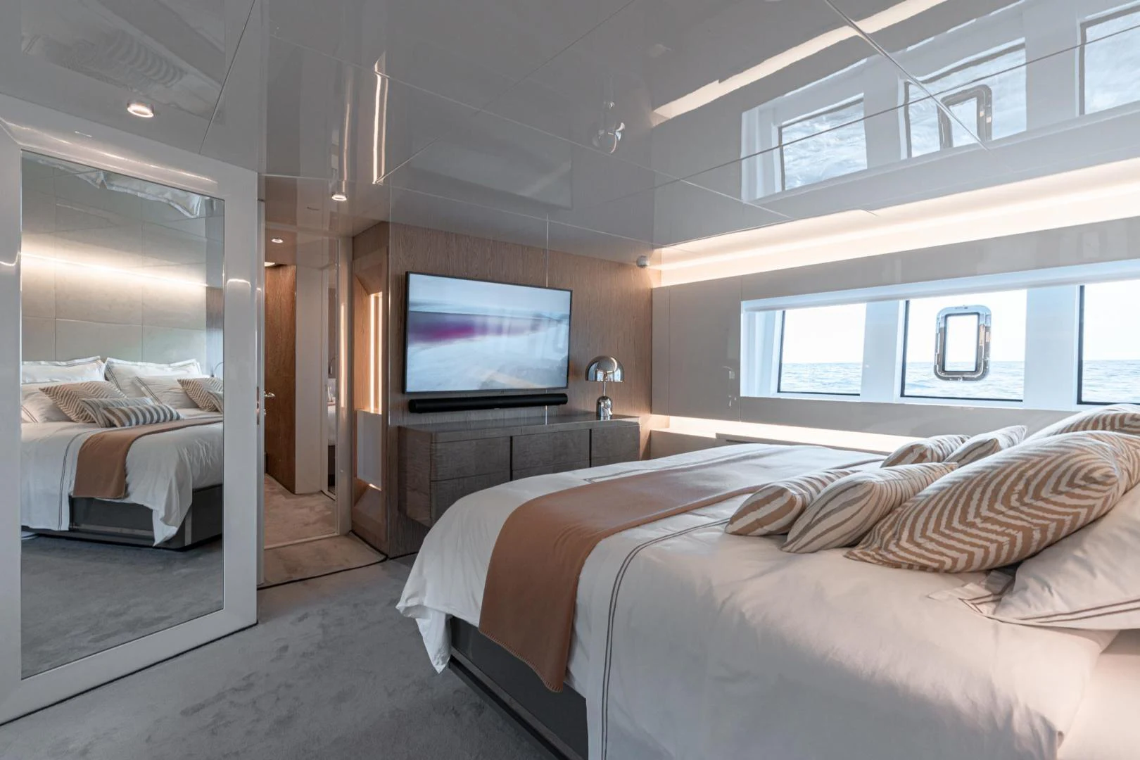a bedroom with a tv on the wall aboard MOTEK Yacht for Sale