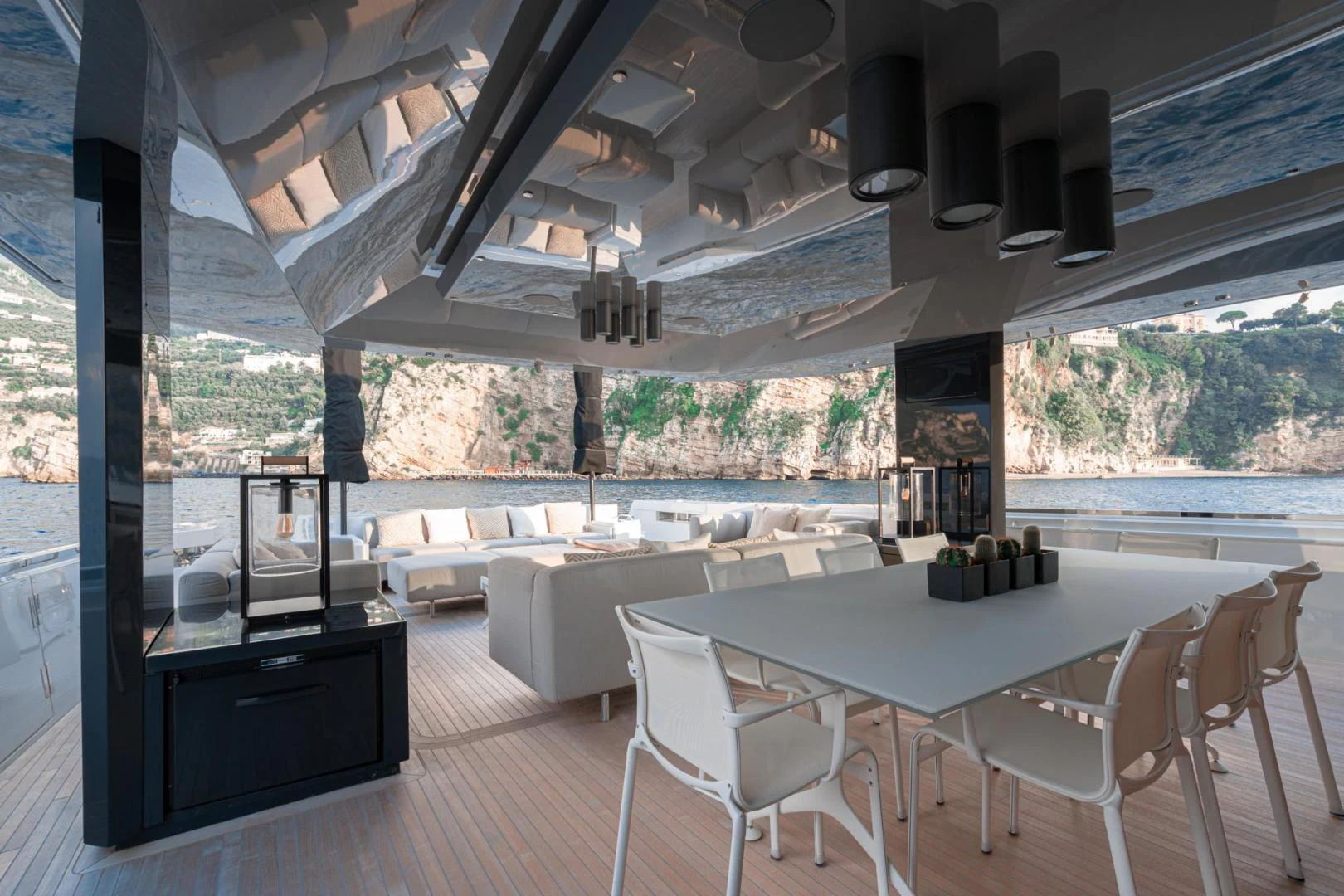 a large room with a table and chairs aboard MOTEK Yacht for Sale