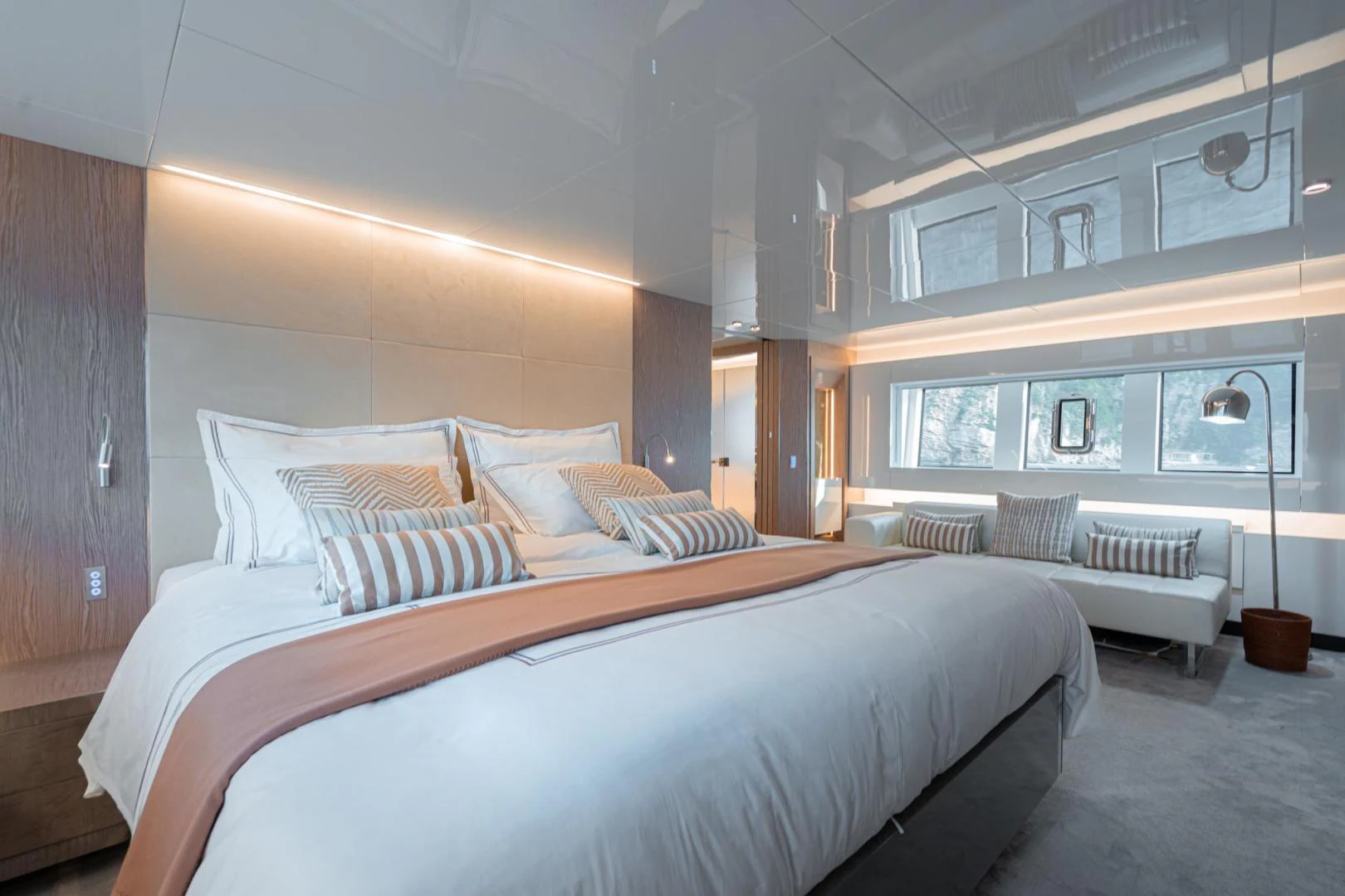 a room with a bed and a window aboard MOTEK Yacht for Sale