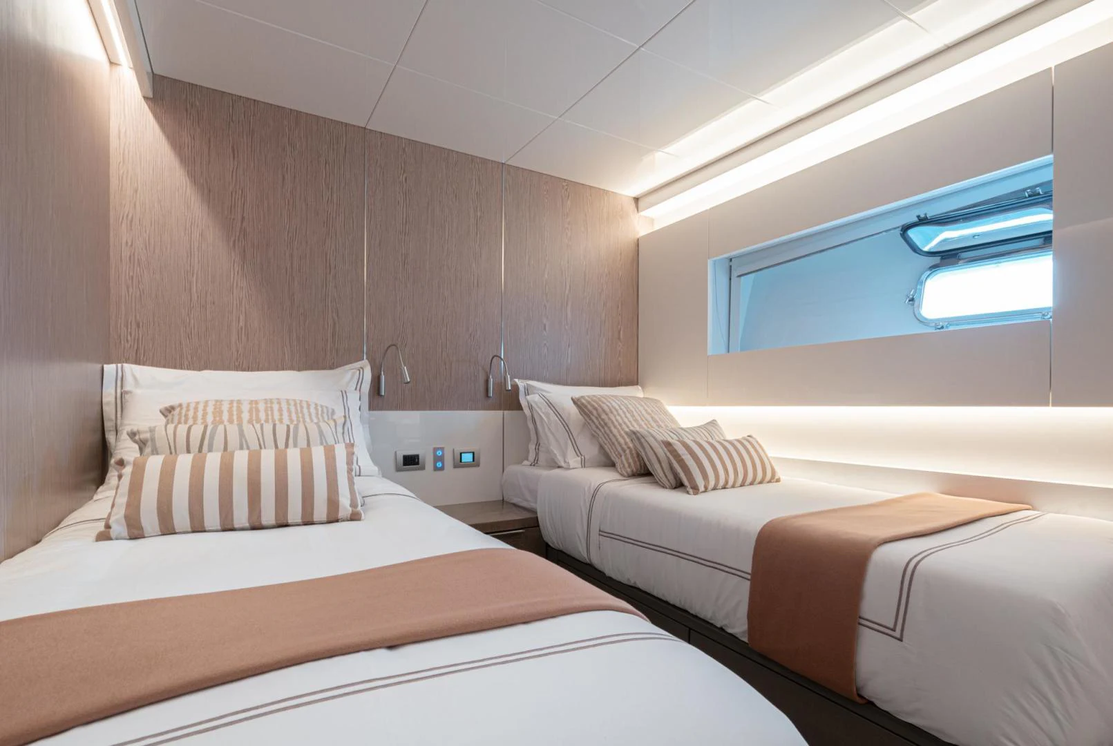 a room with two beds aboard MOTEK Yacht for Sale