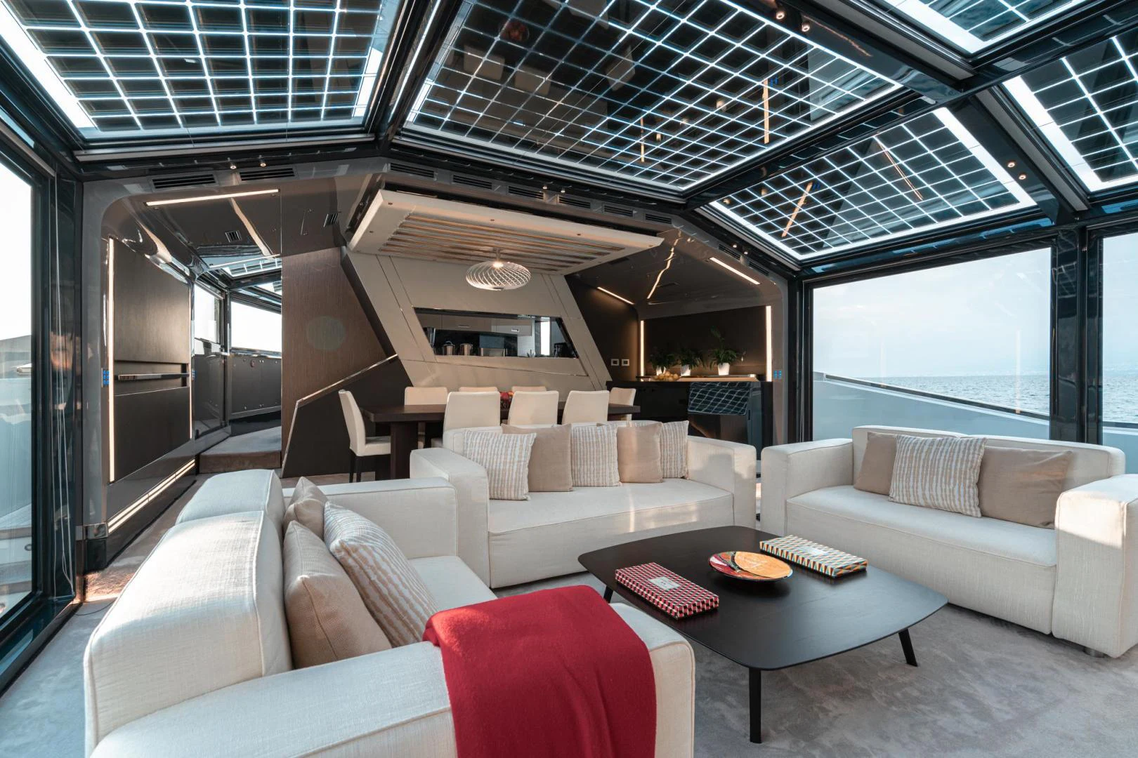 a living room with a couch and a table aboard MOTEK Yacht for Sale