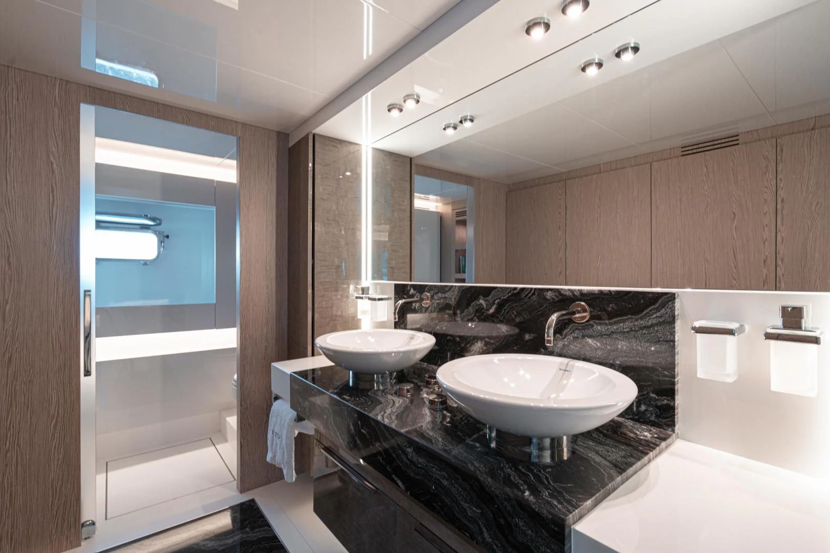 a bathroom with sinks and mirrors aboard MOTEK Yacht for Sale
