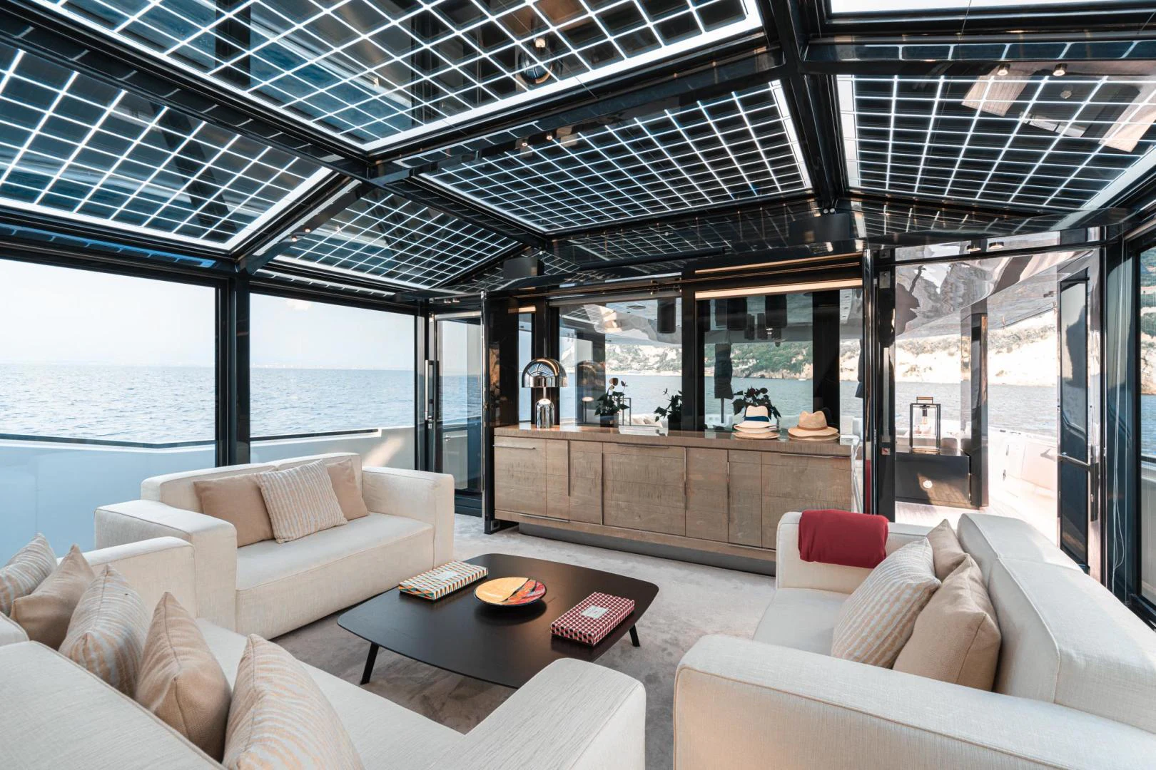 a living room with a large window aboard MOTEK Yacht for Sale