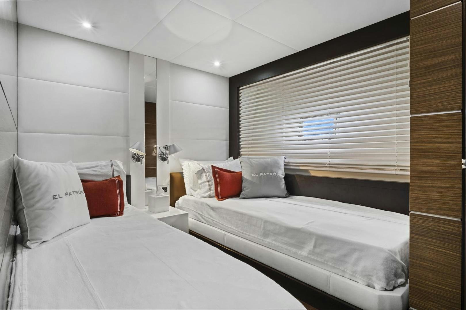 a couple of beds in a hotel room aboard EL PATRON Yacht for Sale