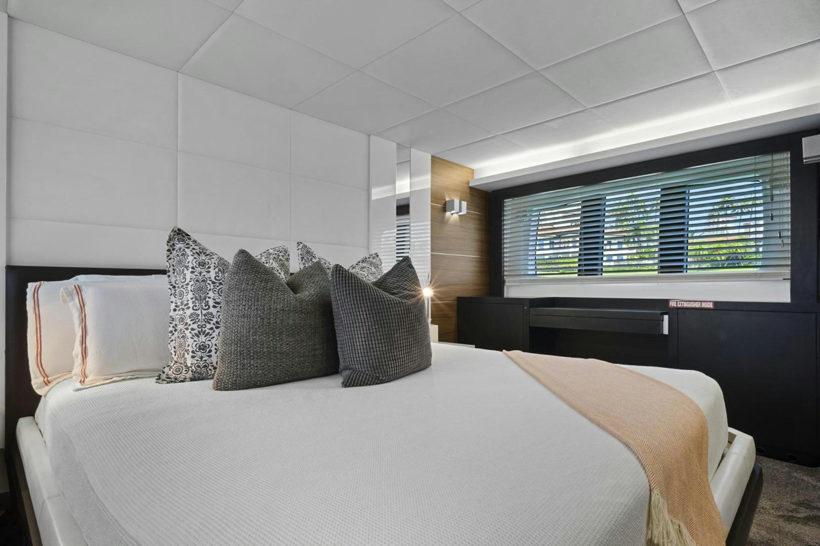 a bed with pillows aboard EL PATRON Yacht for Sale