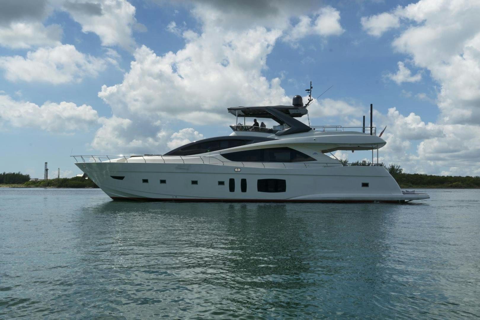 a white yacht on the water aboard EL PATRON Yacht for Sale