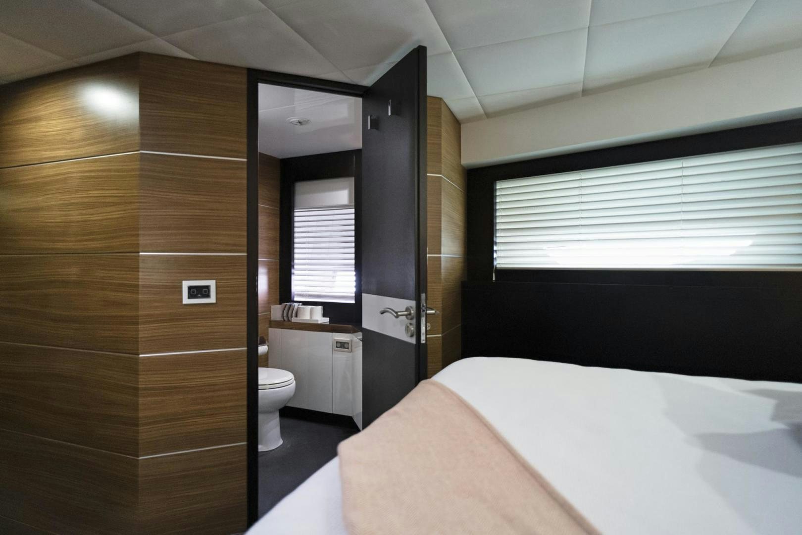 a bathroom with a tub and a sink aboard EL PATRON Yacht for Sale