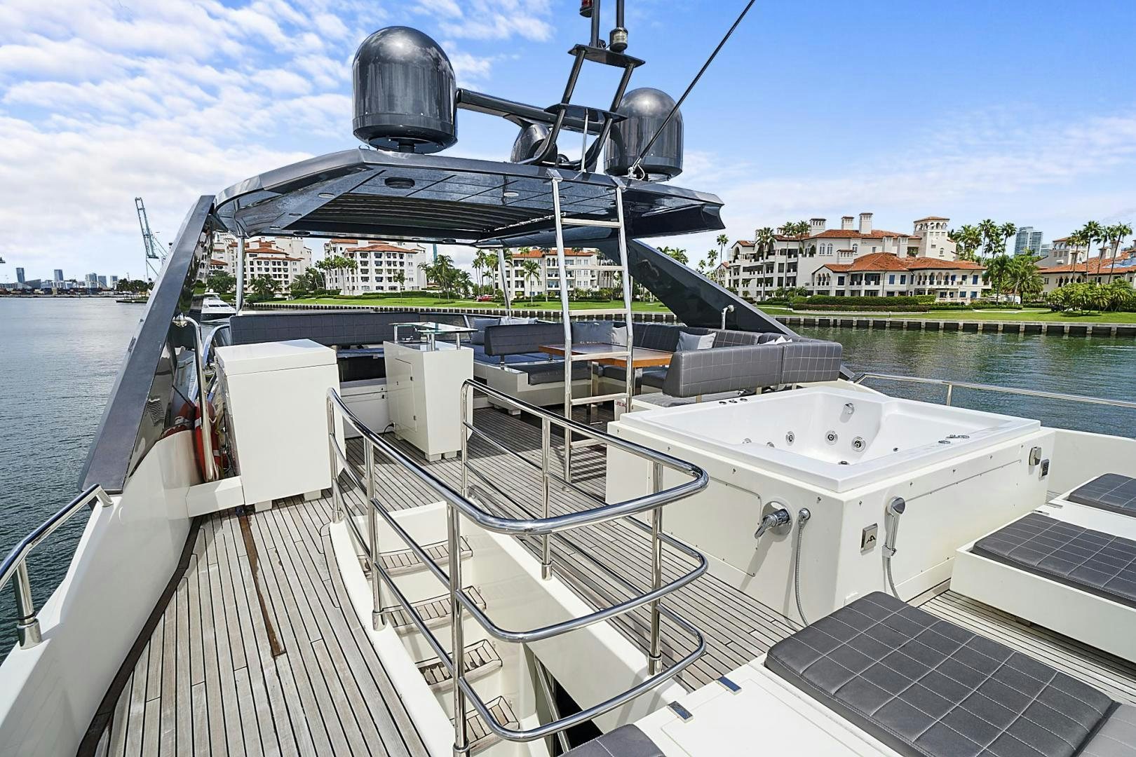 a large metal boat on a dock aboard EL PATRON Yacht for Sale