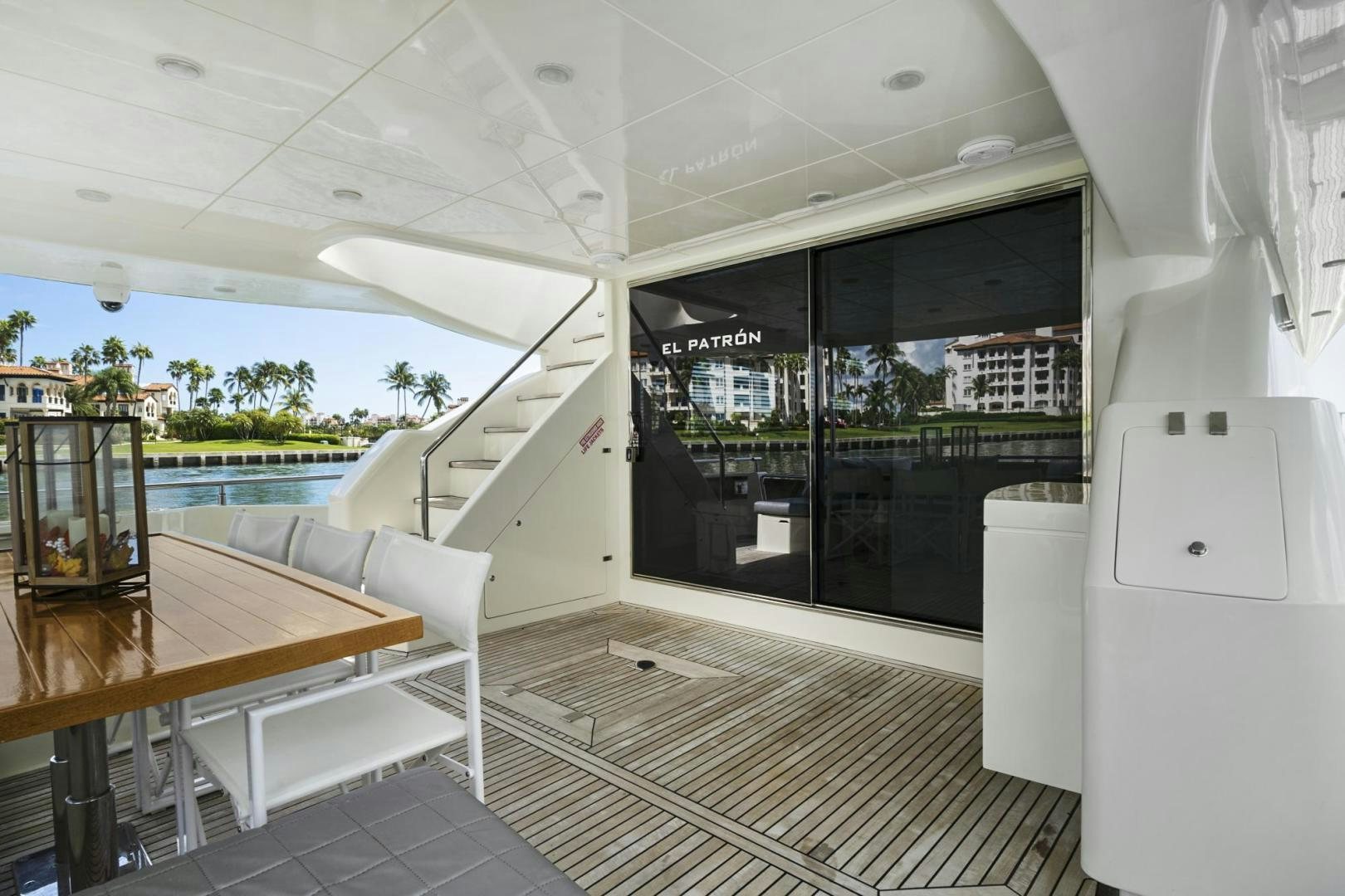 a room with a table and chairs aboard EL PATRON Yacht for Sale