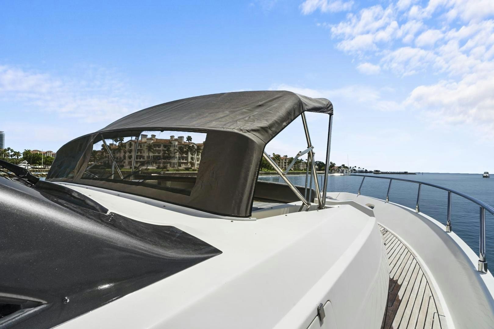 a car with a side mirror aboard EL PATRON Yacht for Sale