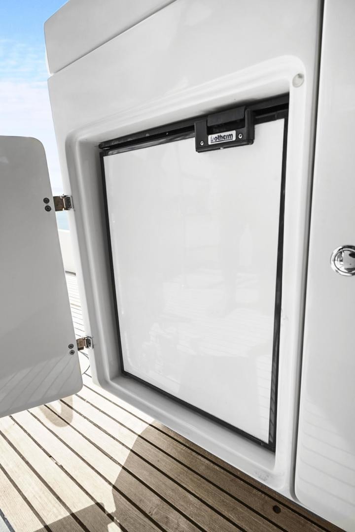 a white rectangular object on a wooden surface aboard EL PATRON Yacht for Sale