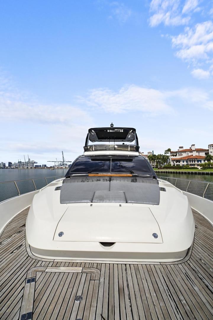a white car with a black top aboard EL PATRON Yacht for Sale