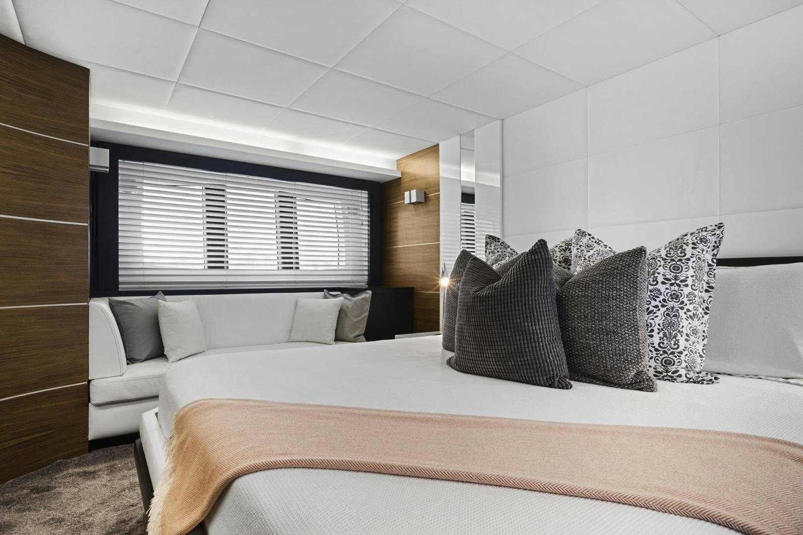 a bed with pillows aboard EL PATRON Yacht for Sale