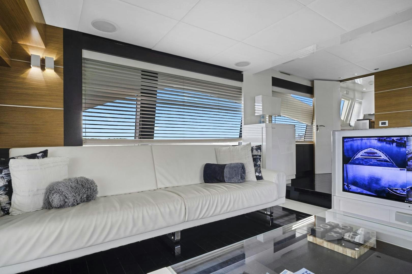 a living room with a large window aboard EL PATRON Yacht for Sale