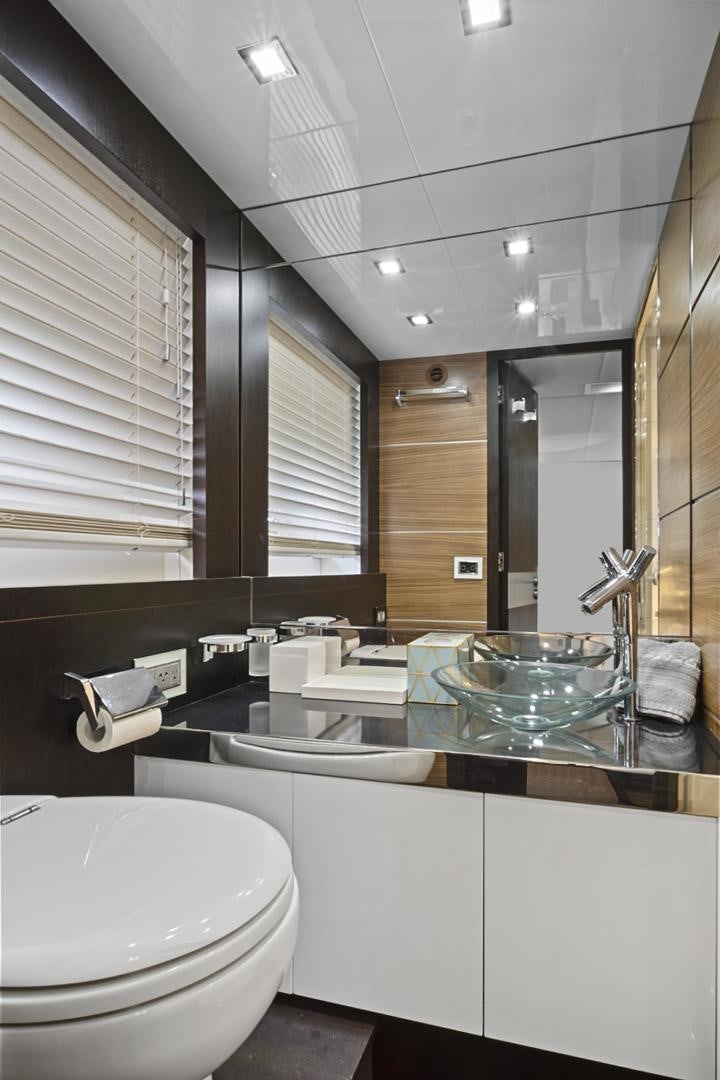 a bathroom with a large mirror aboard EL PATRON Yacht for Sale