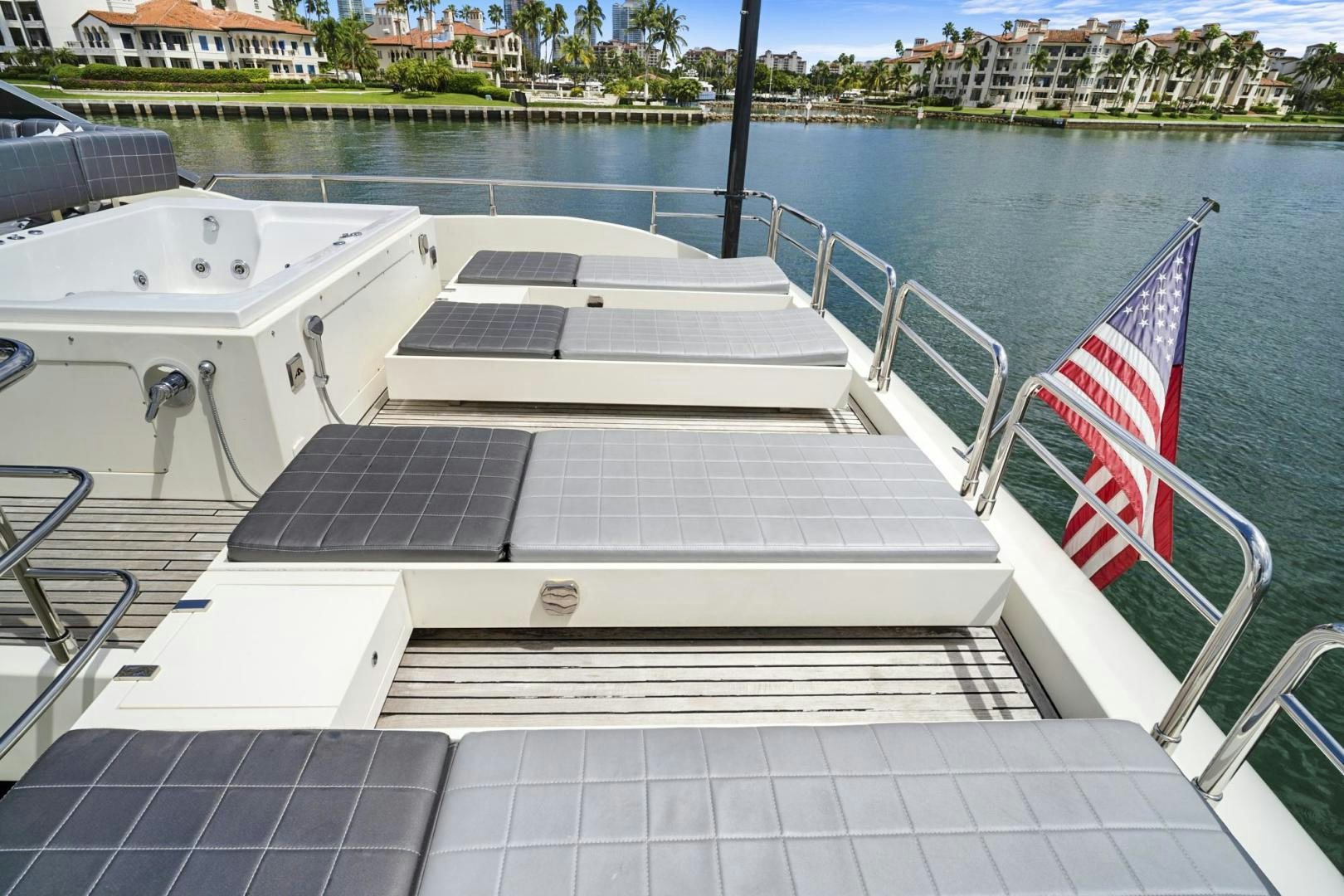 a boat with a flag on the front aboard EL PATRON Yacht for Sale