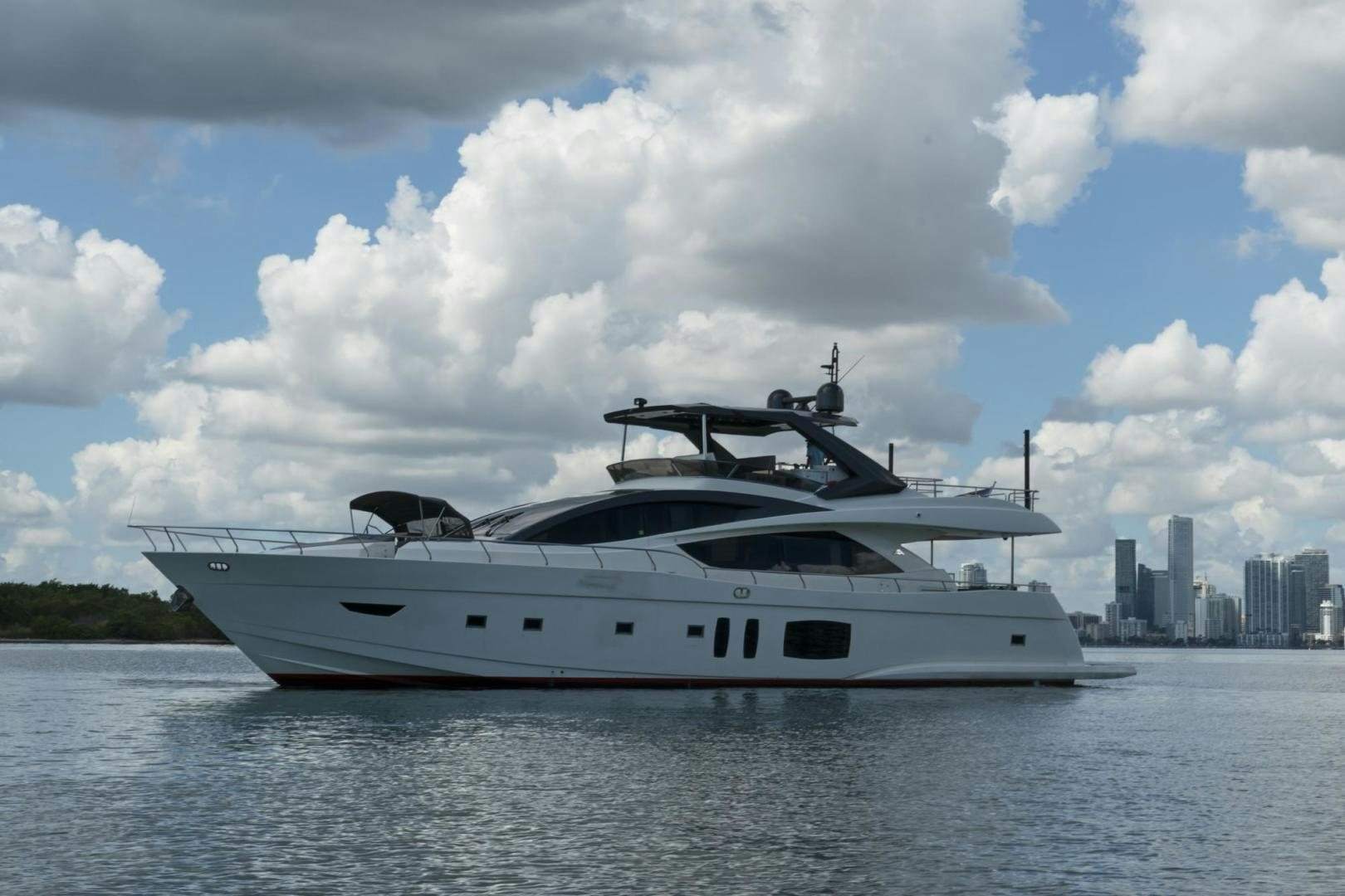 a white yacht on the water aboard EL PATRON Yacht for Sale