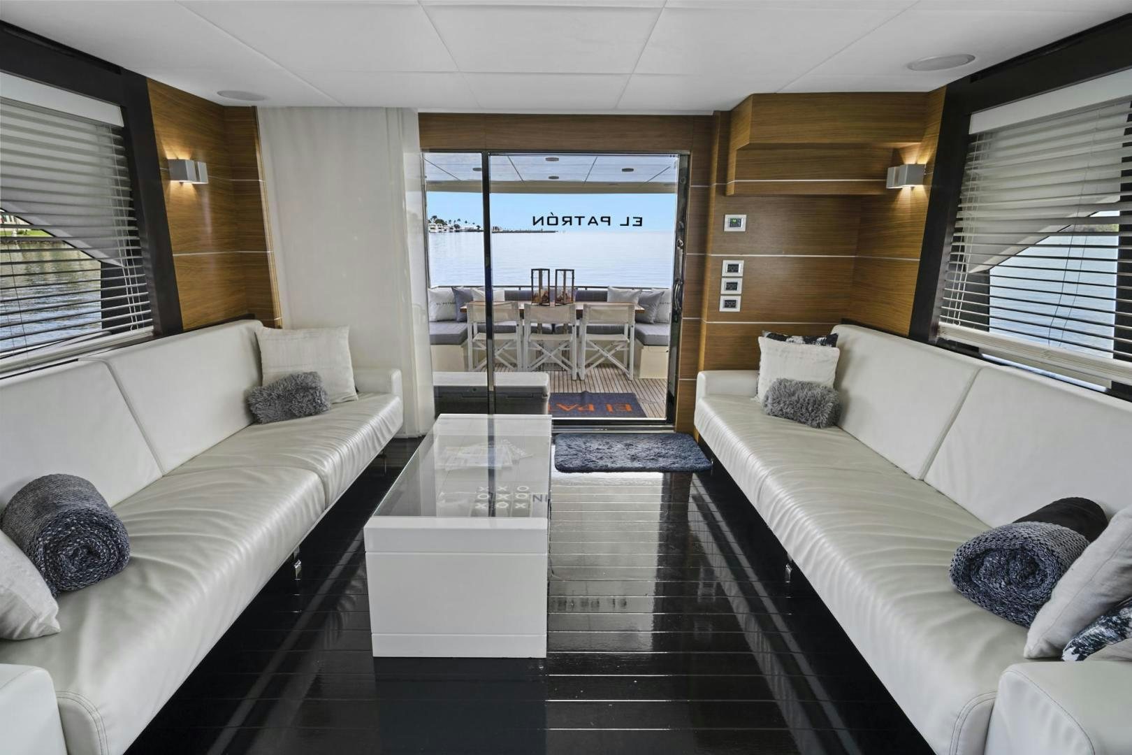 a living room with a large glass door aboard EL PATRON Yacht for Sale