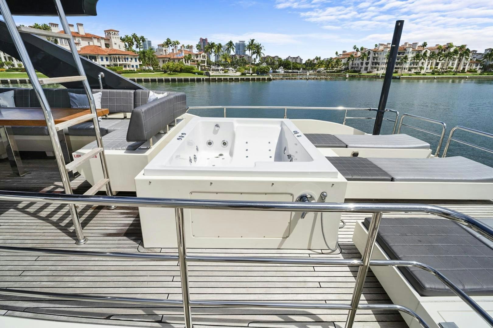 a row of white boats on a dock aboard EL PATRON Yacht for Sale