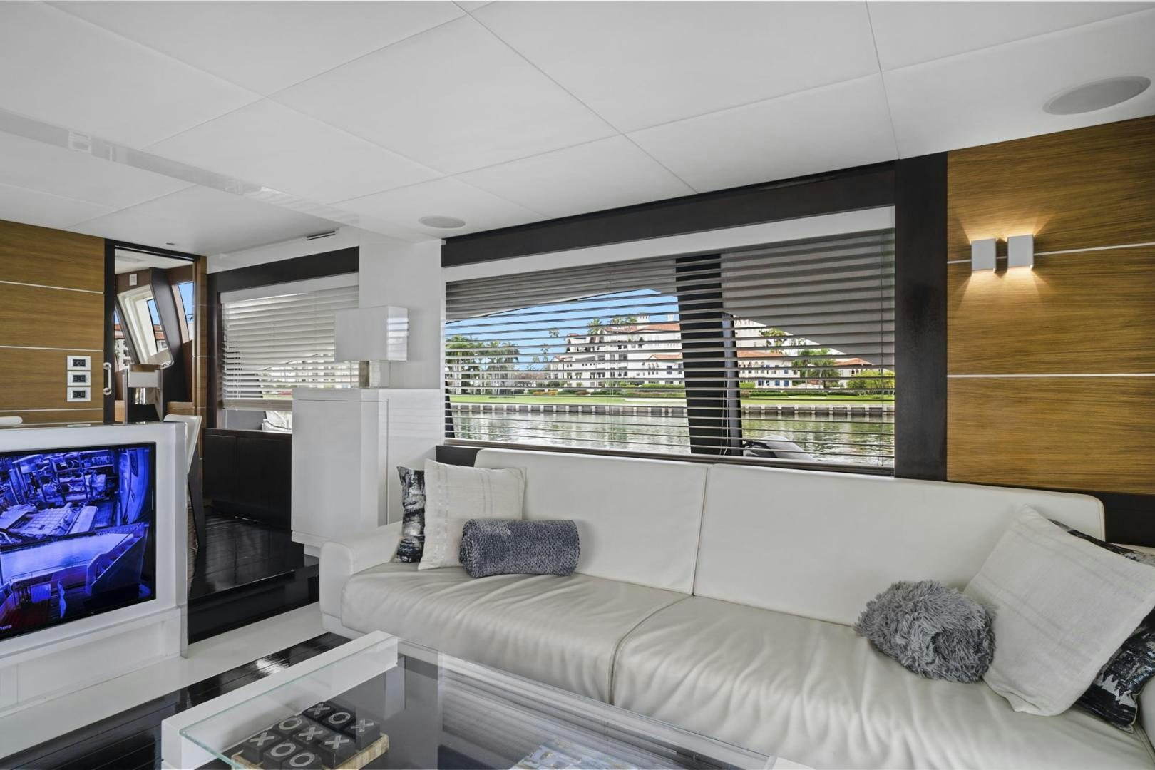 a living room with a large window aboard EL PATRON Yacht for Sale