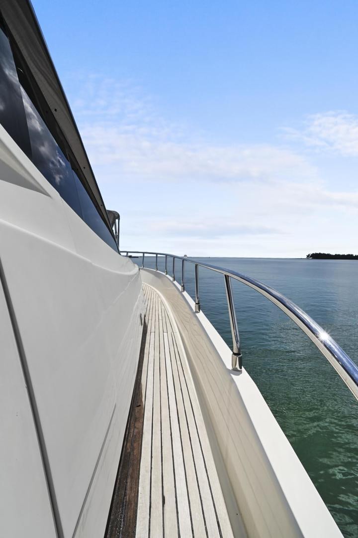 a long white boat on water aboard EL PATRON Yacht for Sale