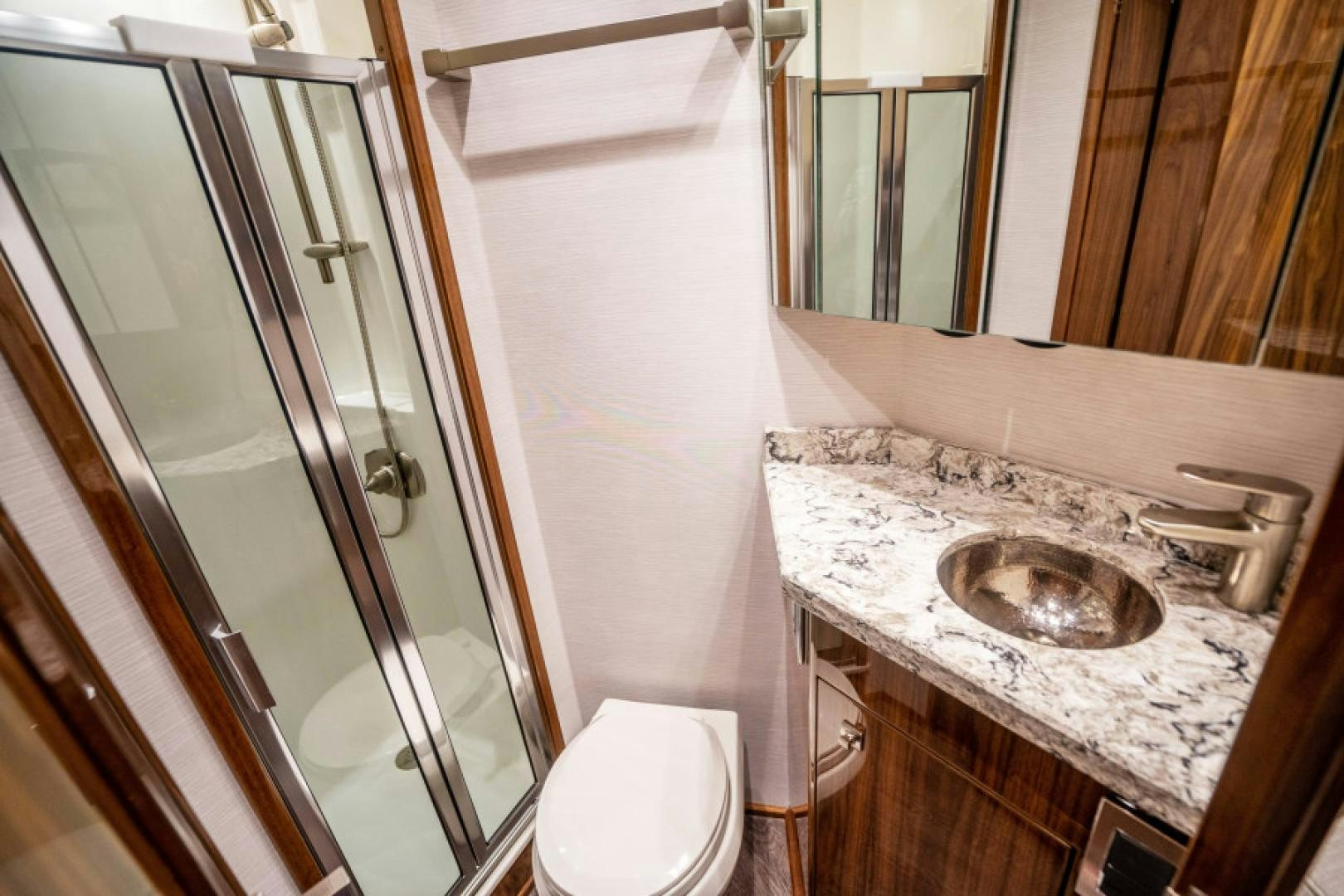 a bathroom with a sink and toilet aboard TIKI BAR Yacht for Sale