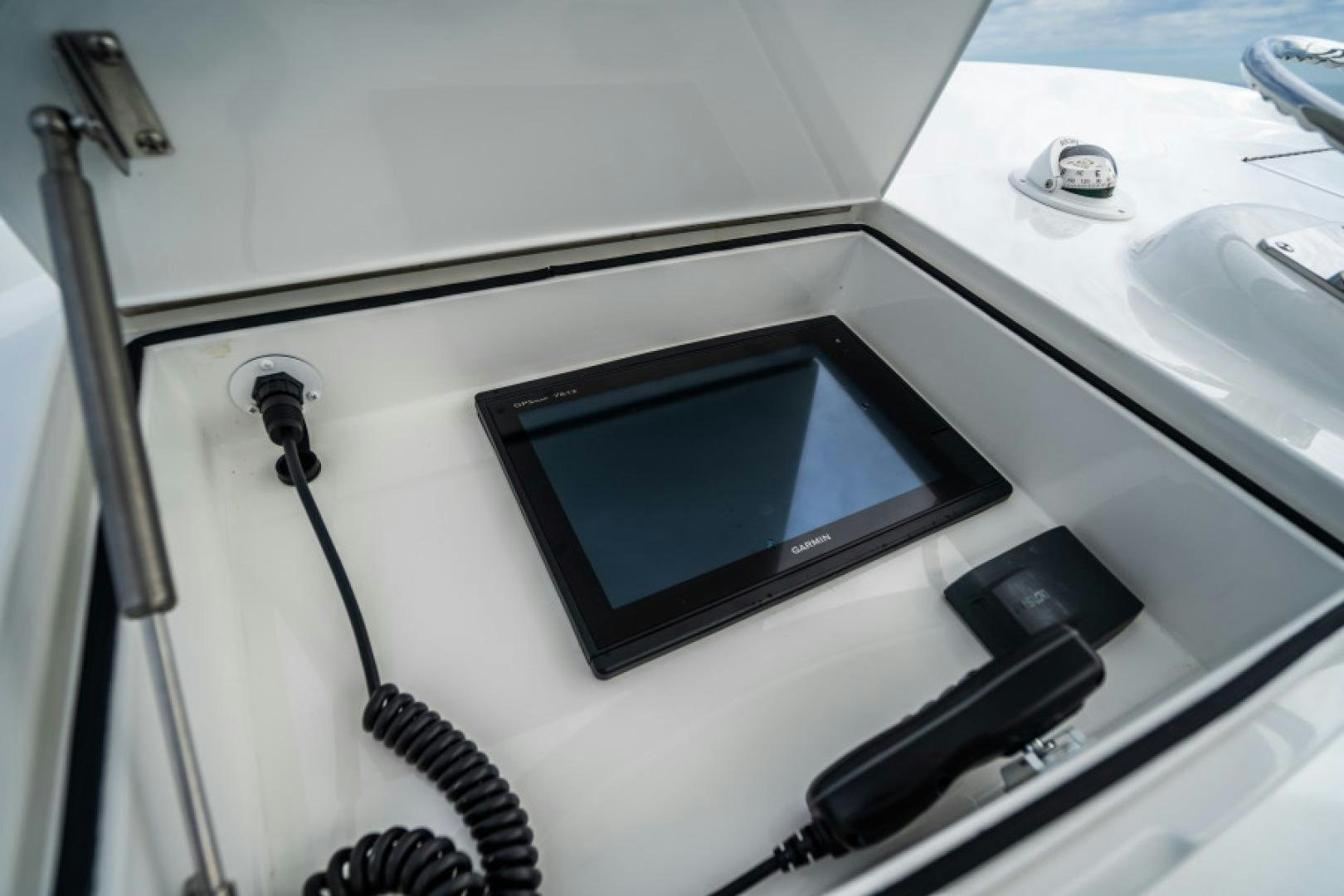 a white rectangular object with a black screen on it aboard TIKI BAR Yacht for Sale