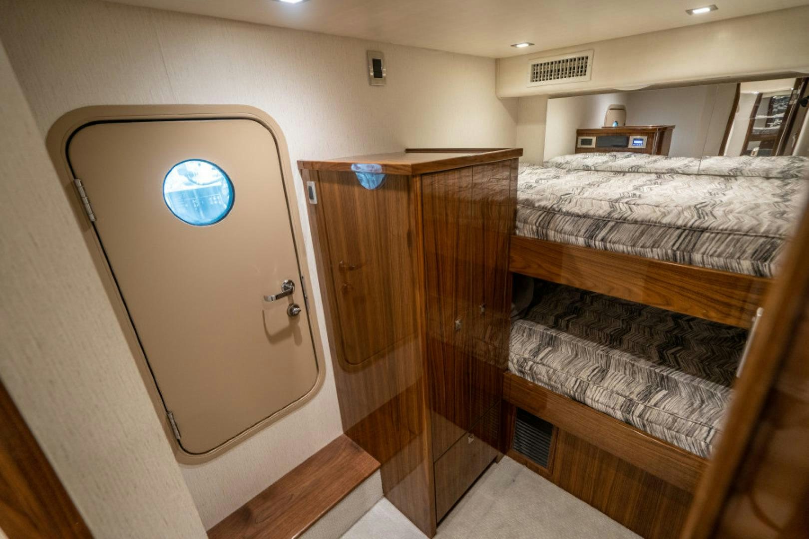 a room with a mirror and a bed aboard TIKI BAR Yacht for Sale