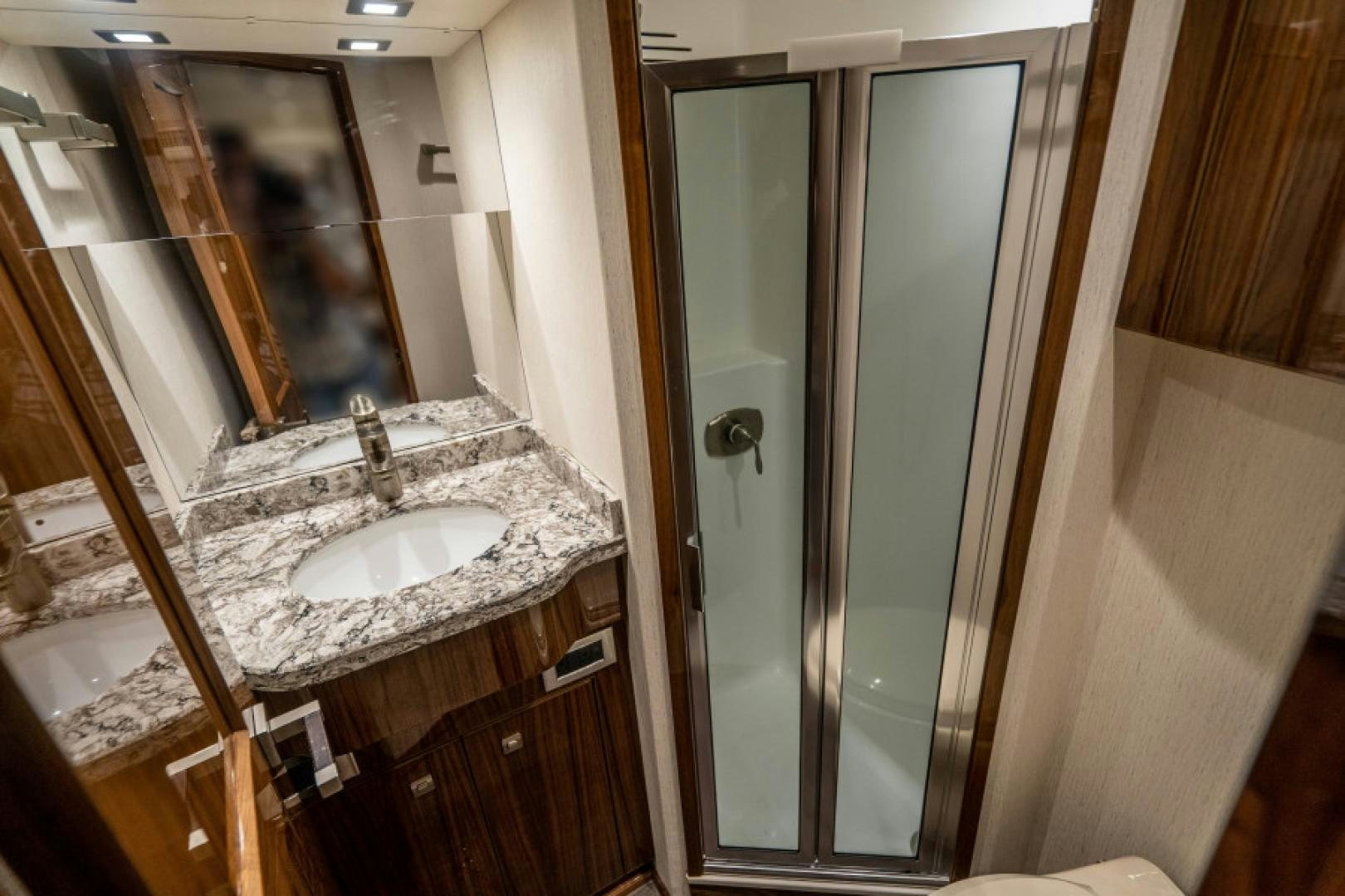 a bathroom with a sink and a mirror aboard TIKI BAR Yacht for Sale