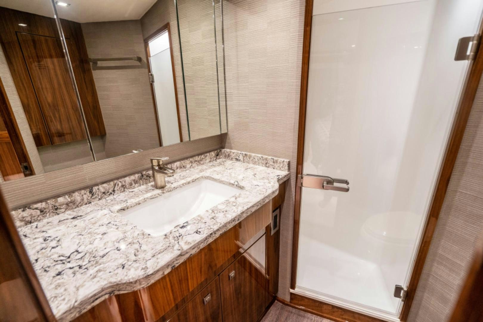 a bathroom with a marble counter top aboard TIKI BAR Yacht for Sale