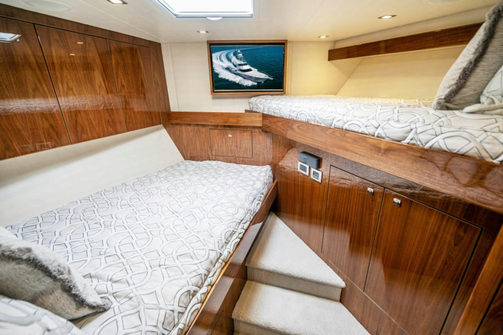 a room with wooden furniture aboard TIKI BAR Yacht for Sale