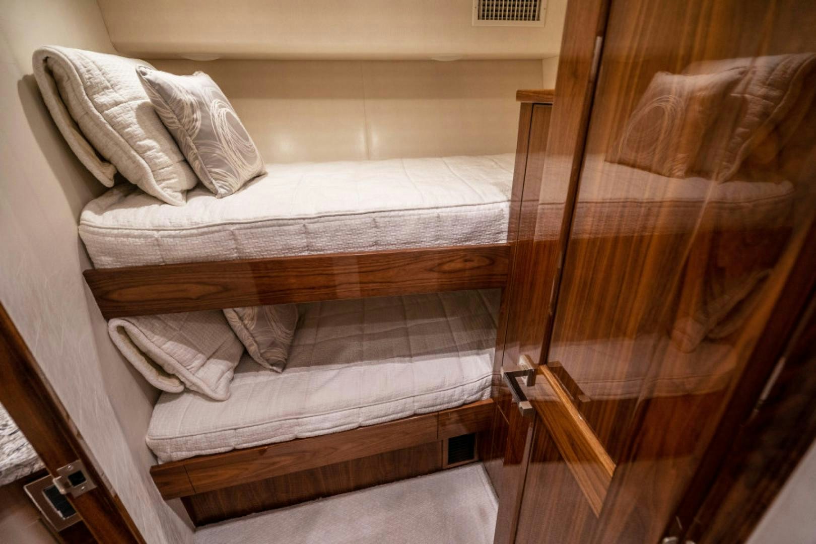 a bed with white sheets aboard TIKI BAR Yacht for Sale