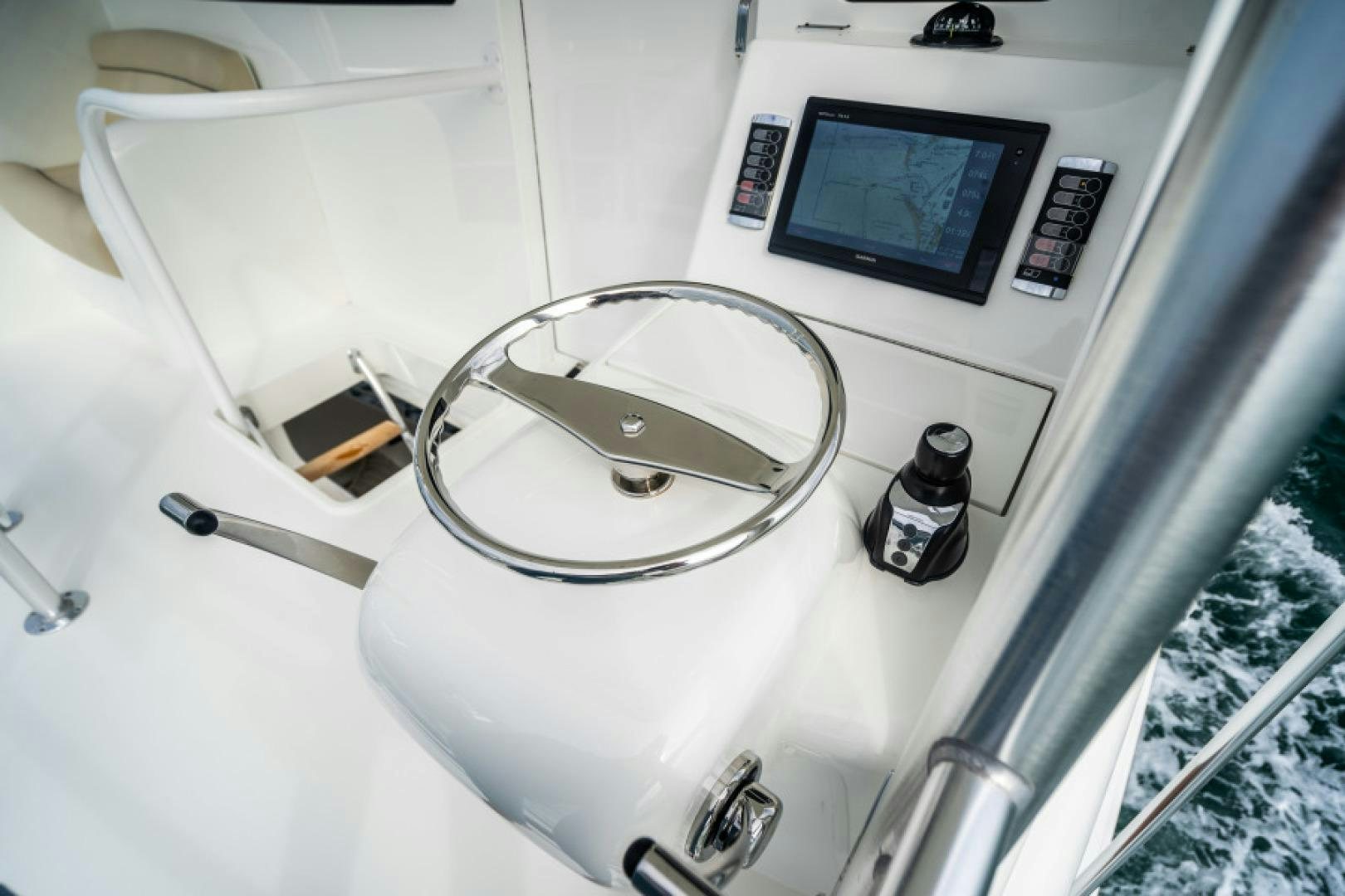 a white machine with a screen aboard TIKI BAR Yacht for Sale