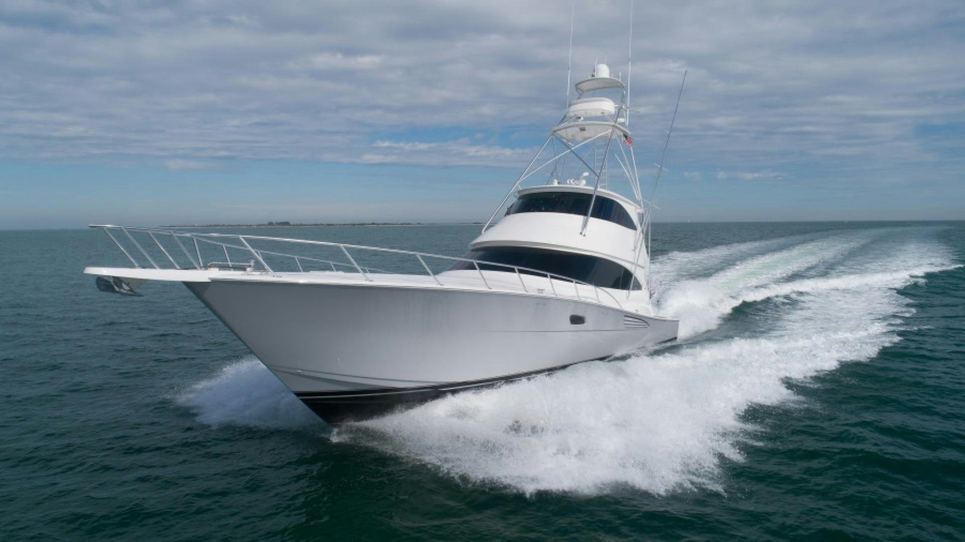 a white yacht on the water aboard TIKI BAR Yacht for Sale