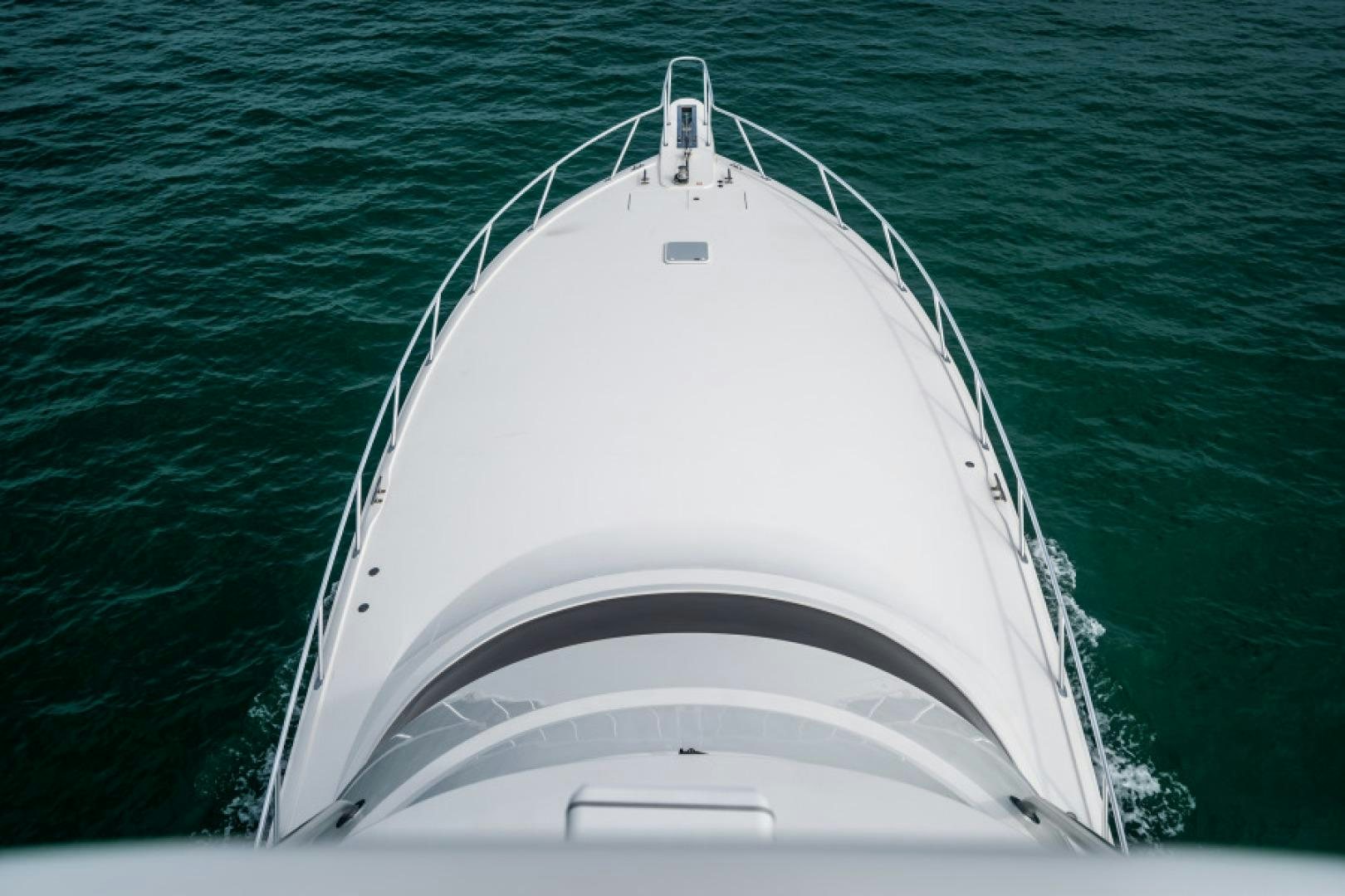 a white boat in the water aboard TIKI BAR Yacht for Sale