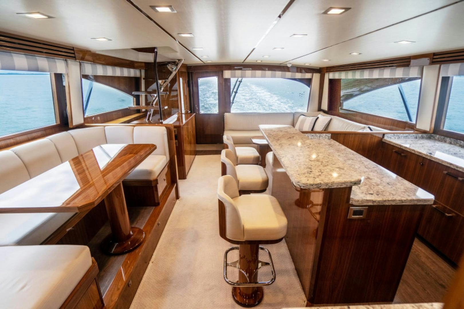 a room with a table and chairs aboard TIKI BAR Yacht for Sale