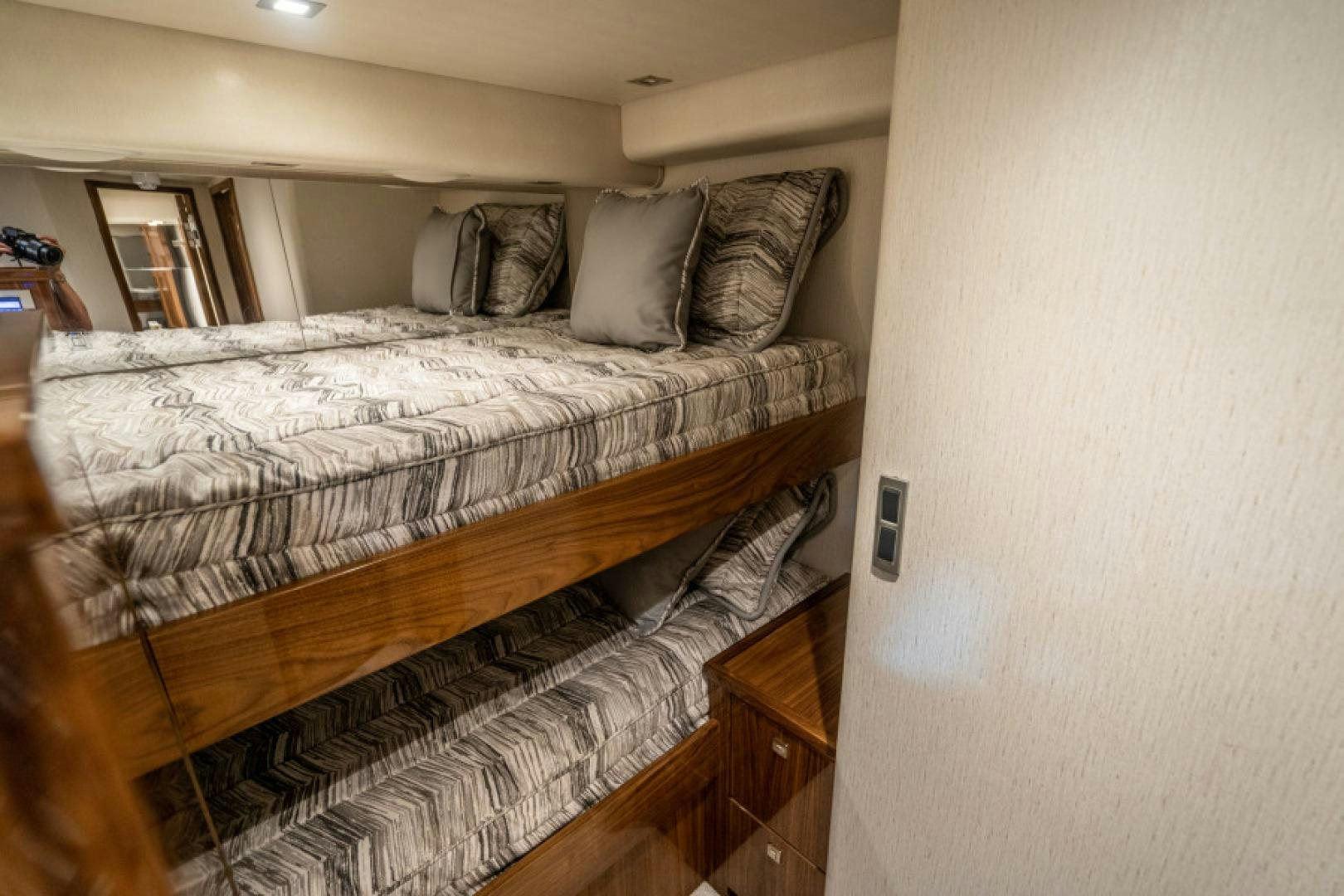 a bed with a white comforter aboard TIKI BAR Yacht for Sale