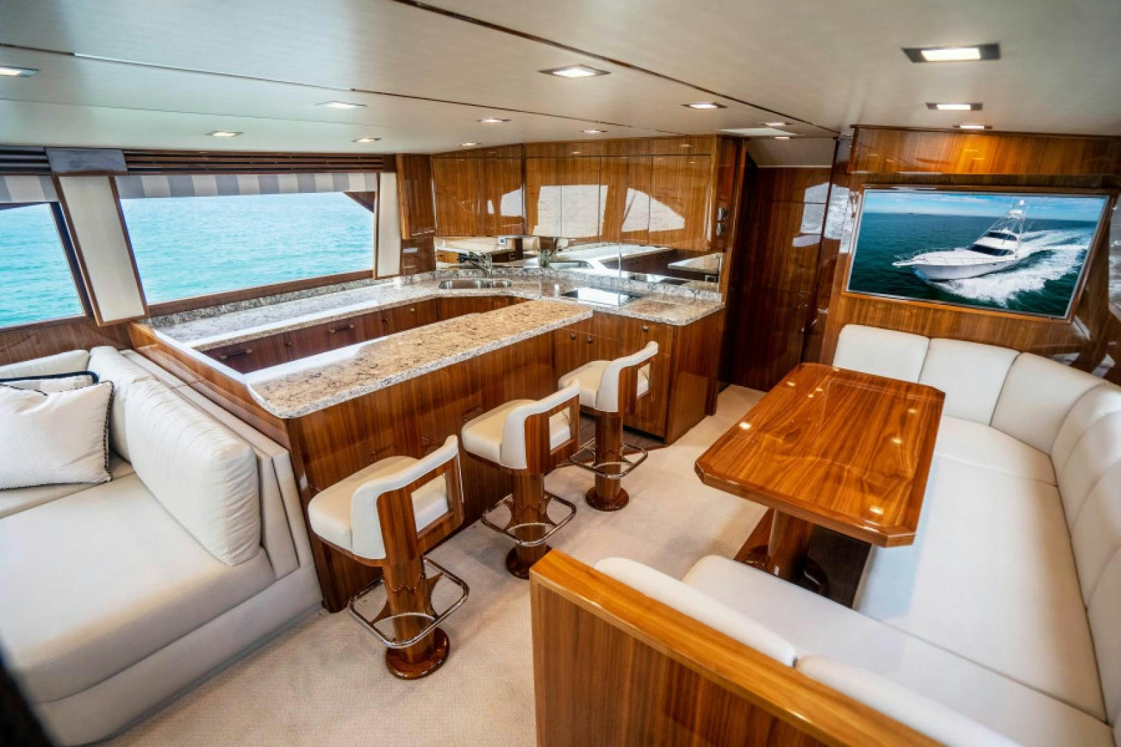 a large room with a table and chairs aboard TIKI BAR Yacht for Sale