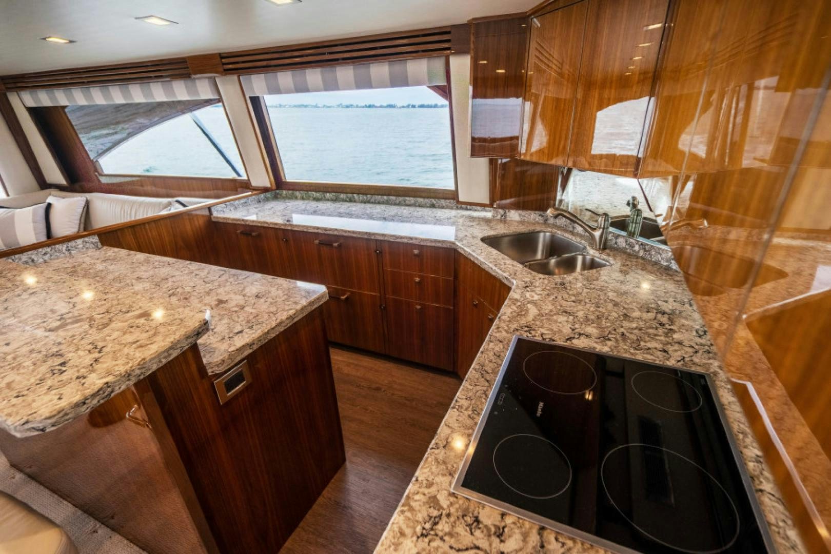 a kitchen with a large island aboard TIKI BAR Yacht for Sale
