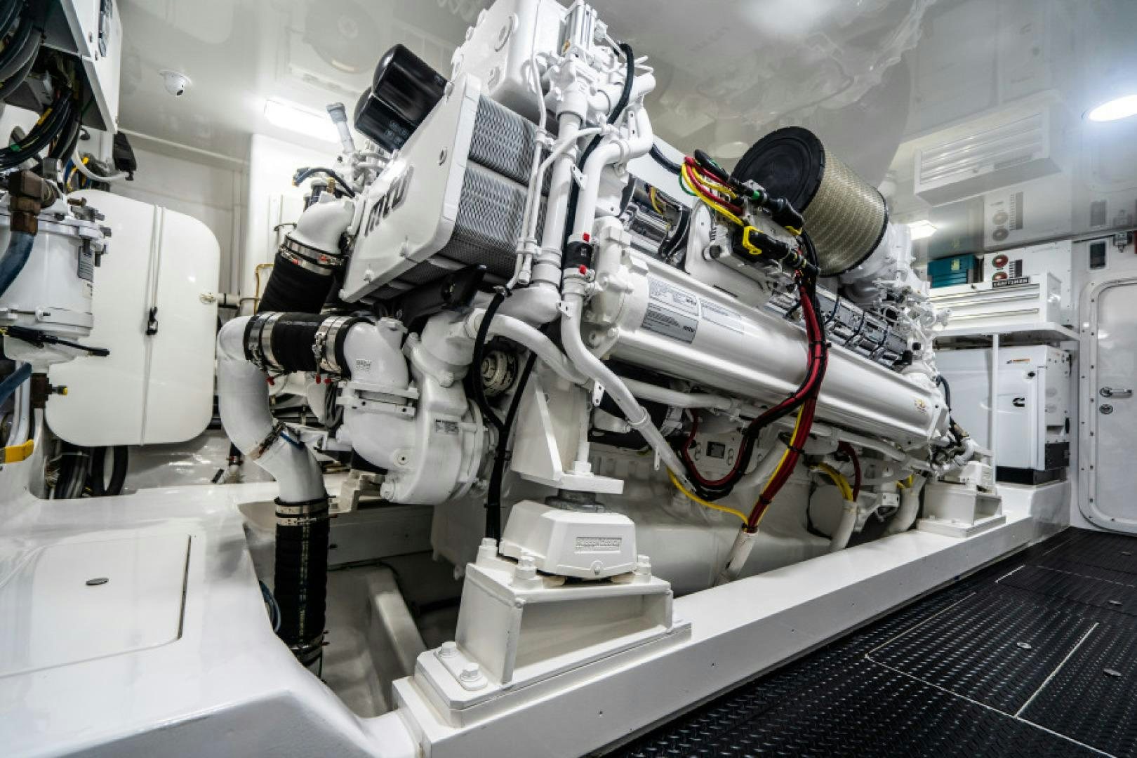 a white machine with red and yellow wires aboard TIKI BAR Yacht for Sale