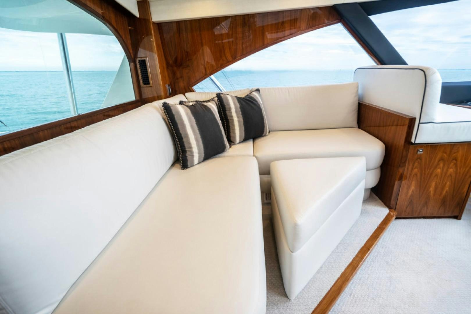 a couch with a pillow on it aboard TIKI BAR Yacht for Sale