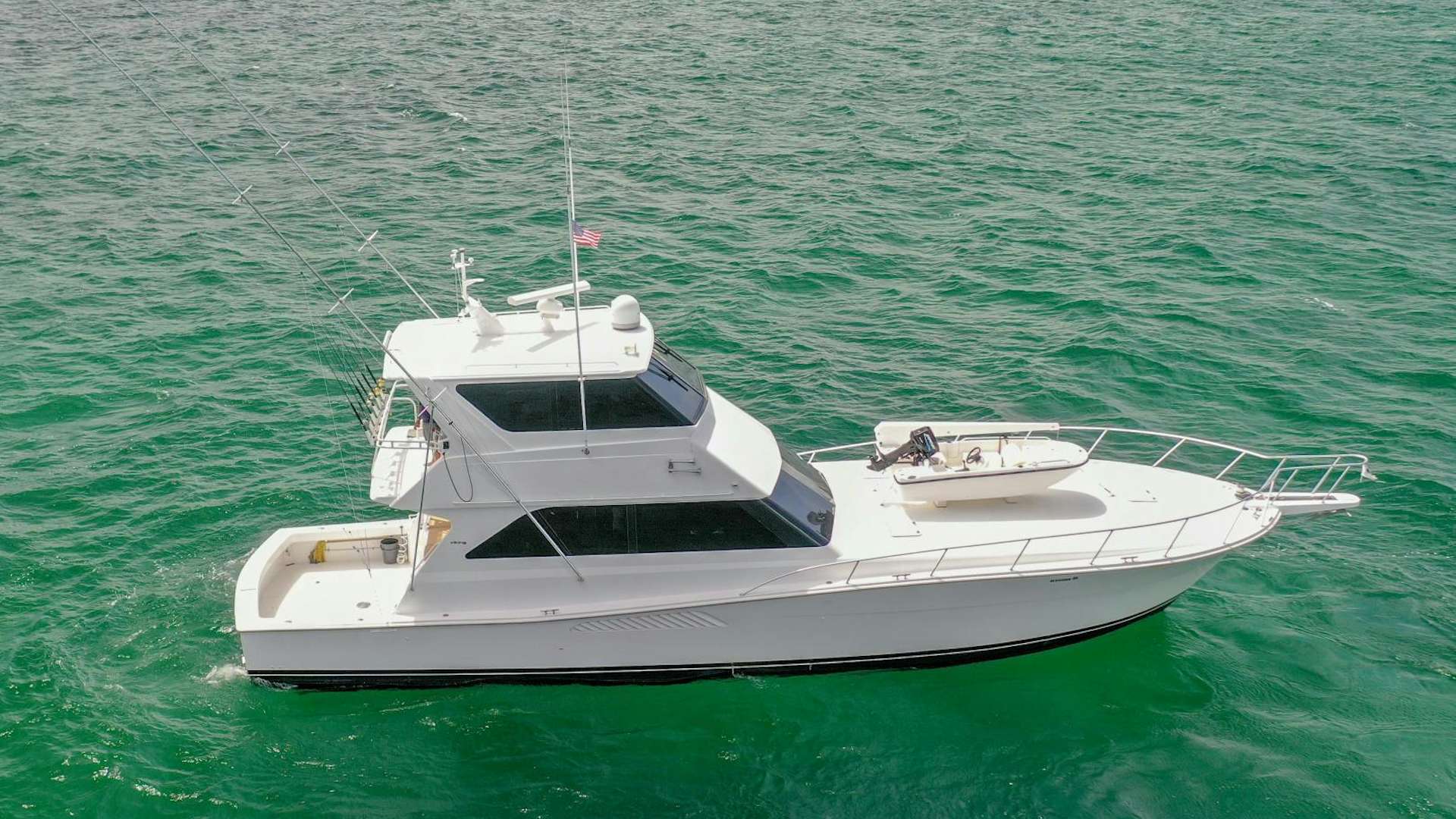 a white boat in the water aboard GOOSE Yacht for Sale