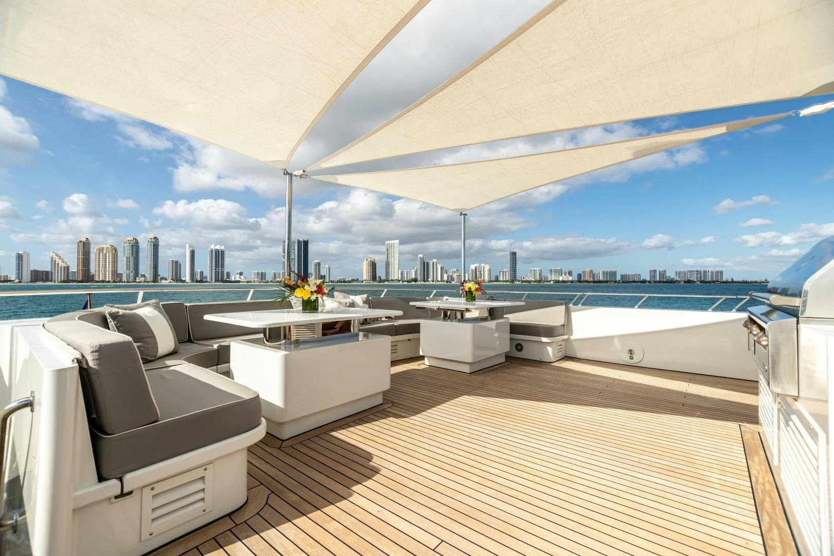 a room with a view of a city and a large body of water aboard EXPLORA Yacht for Sale