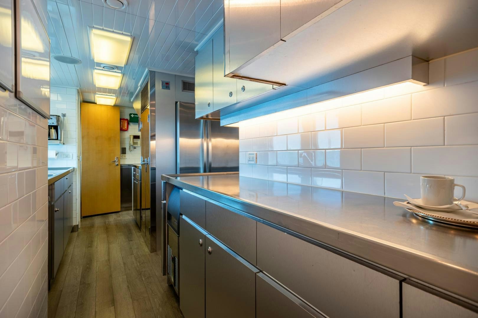 a kitchen with a countertop aboard EXPLORA Yacht for Sale