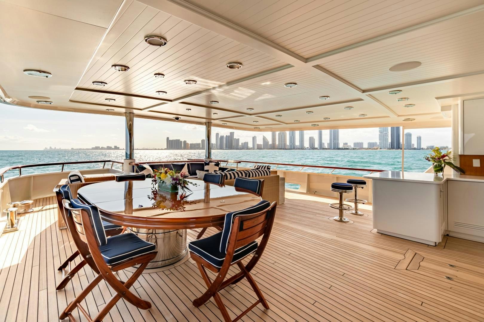 a table and chairs on a boat aboard EXPLORA Yacht for Sale