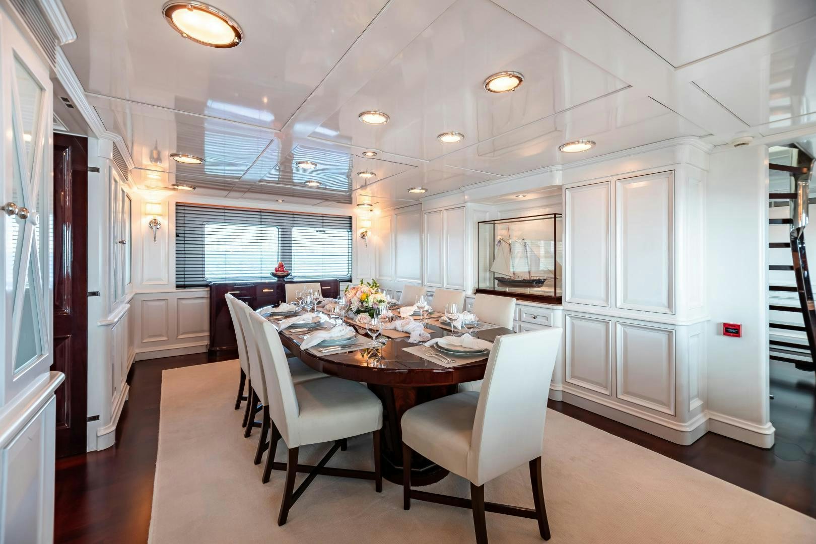 a large kitchen with a dining table aboard EXPLORA Yacht for Sale