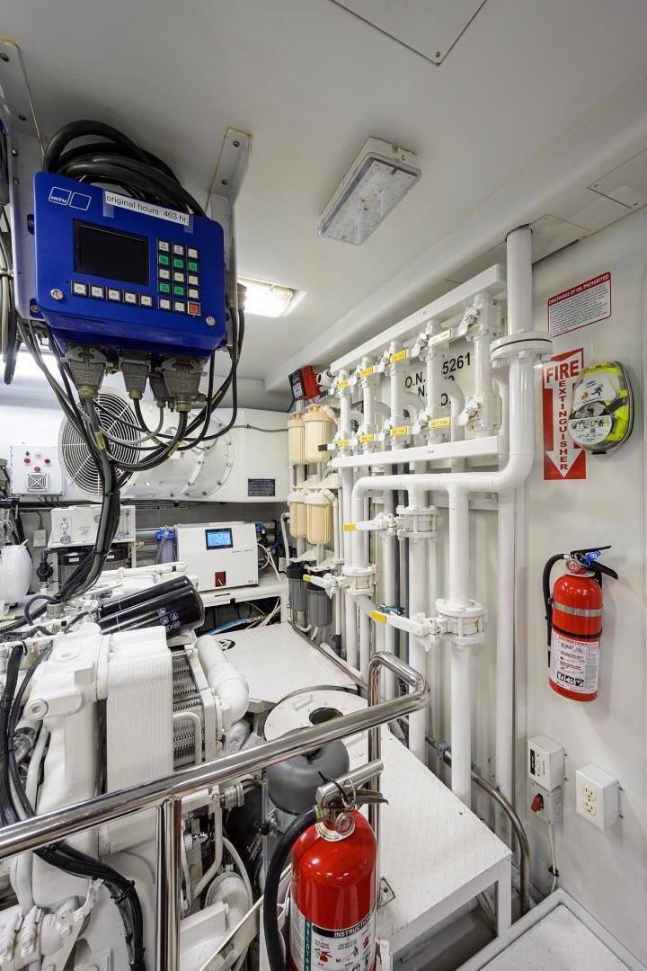 a white room with shelves and equipment aboard THE CROWN ROYAL Yacht for Sale