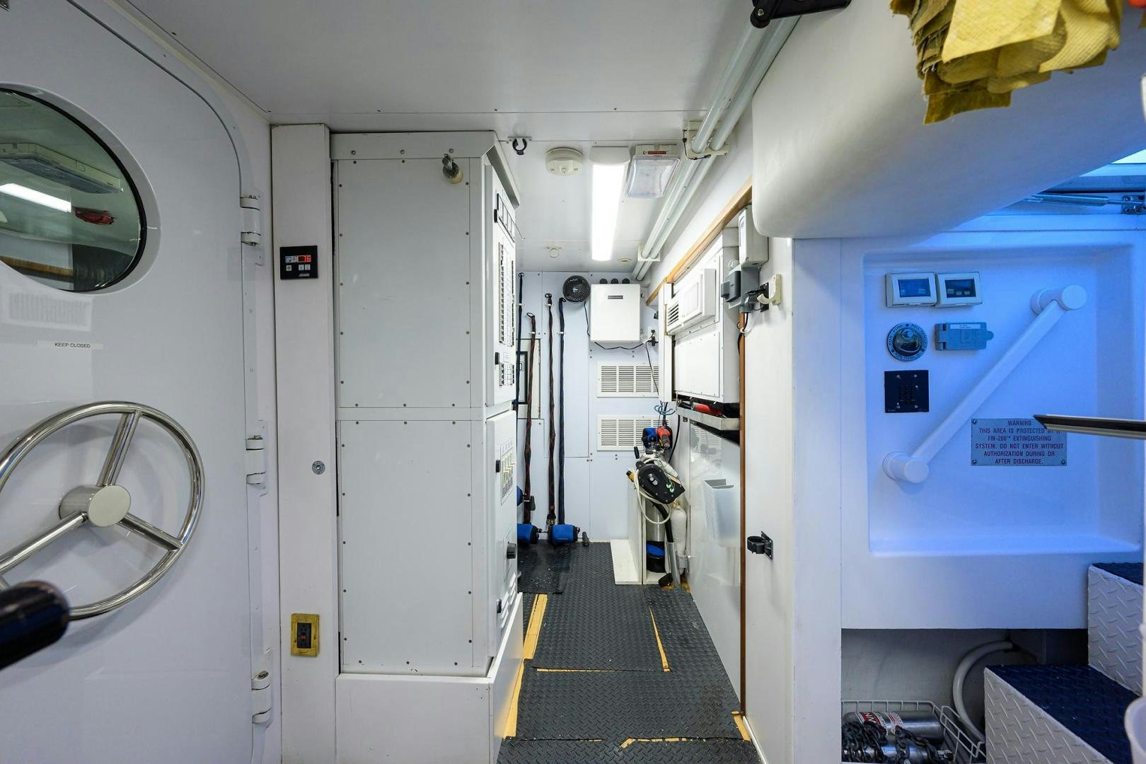 a hallway with white walls aboard THE CROWN ROYAL Yacht for Sale